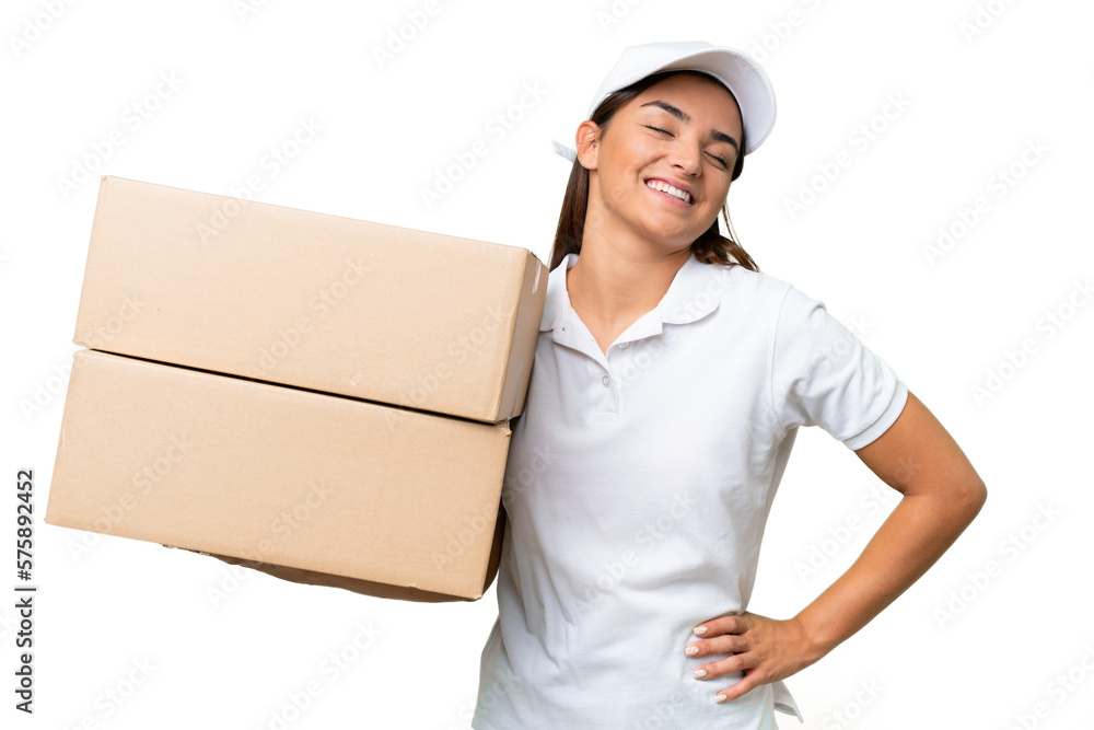 Delivery caucasian woman holding boxes isolated on green chroma background posing with arms at hip and smiling Delivery caucasian woman holding boxes isolated on green chroma background posing with arms at hip and smiling