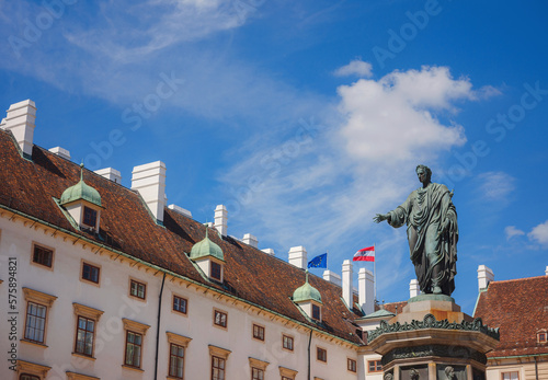 Innerer Burghof of Hofburg imperial Palace , Part of Hofburg with Amalientrakt and Amalienburg. Monument to Emperor Franz I of Austria. AMOREM MEUM POPULIS MEIS means I give my love to my people