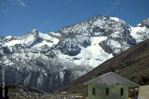 Panoramic landscape view of beautiful snowcapped Zero Point, or Yumesamdong, and distant Himalayan peaks. ZERO POINT SIKKIM (Yumesadong) is situated at an elevation of 15,3000ft. photo