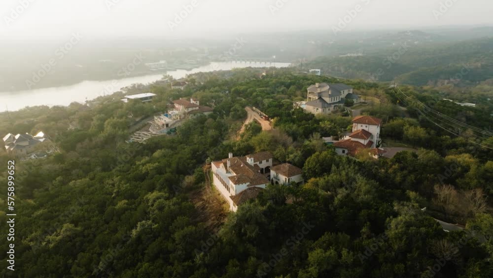 Upscale Suburban Homes in Westlake, Austin Texas overlooking Lake Austin Aerial pan right orbit at sunrise in 4k Upscale Suburban Homes in Westlake, Austin Texas overlooking Lake Austin Aerial pan right orbit at sunrise in 4k