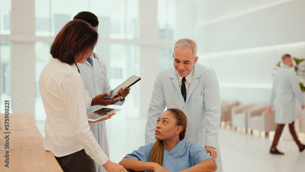 Obraz premium Two multiracial doctors are taking African patient who sitting on a wheelchair to hospital reception to take her history. A female patient receive care from male and female physicians at the hospital.