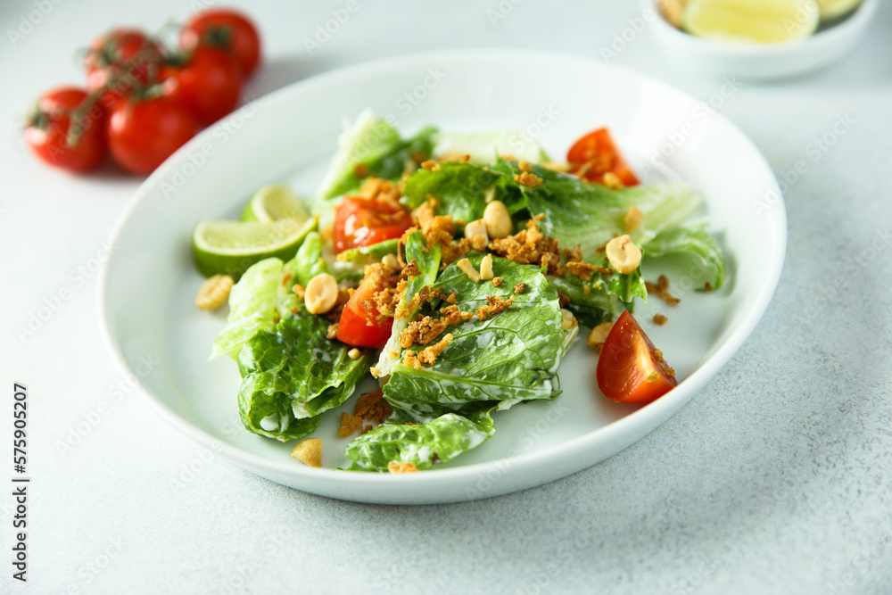 Healthy green salad with cherry tomatoes and peanut Healthy green salad with cherry tomatoes and peanut