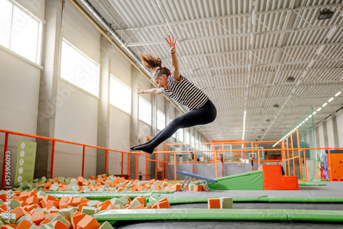 Valokuva Pretty girl in trampoline park having fun