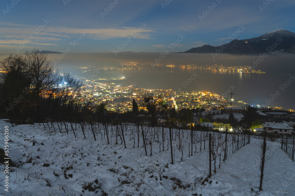 Iseo lake and vineyards of Franciacorta in the night, Brescia province in Lombardy district, Italy, Europe.
