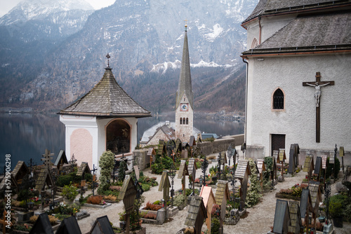 Graves overlooking Lake Hallstatt at the cemetery surrounding the Roman Catholic Parish Church of Hallstatt, Salzkammergut region, Austria