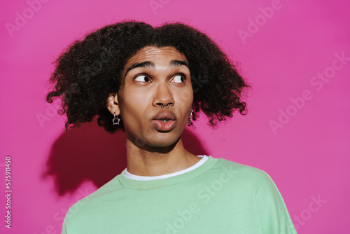 Portrait of young stylish curly african man with piercing © Drobot Dean