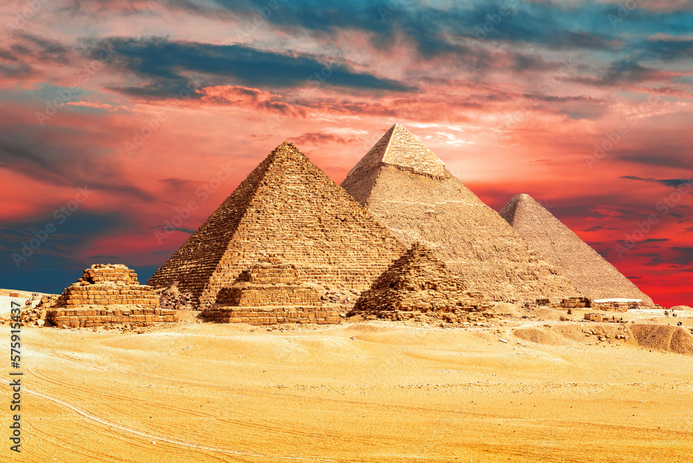 The Pyramids of Egypt in the sands of Giza desert, sunset view, Egypt