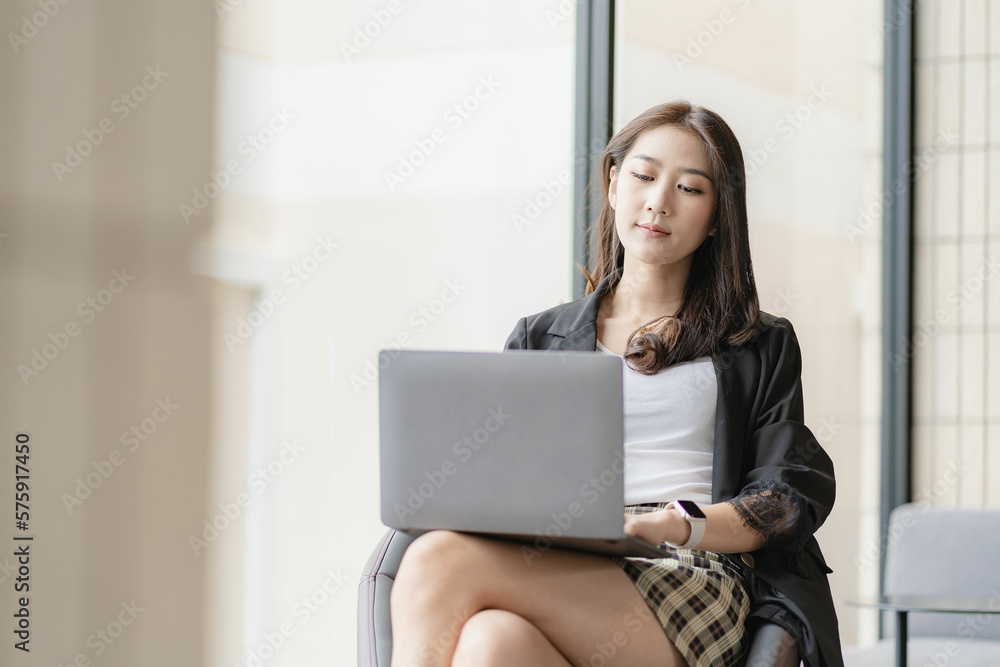 Asian woman working with laptop computer, surfing internet, online shopping, video calling, making friends in free time. Asian woman working with laptop computer, surfing internet, online shopping, video calling, making friends in free time.