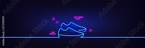 Neon light glow effect. Shoes line icon. Sport footwear sign. Fashion sneakers symbol. 3d line neon glow icon. Brick wall banner. Shoes outline. Vector