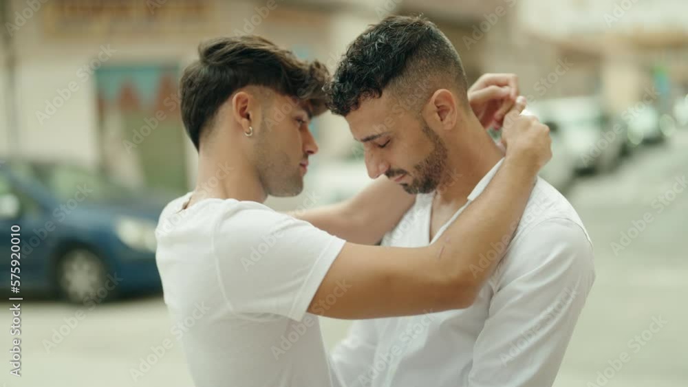 Two hispanic men couple smiling confident hugging each other at street Two hispanic men couple smiling confident hugging each other at street