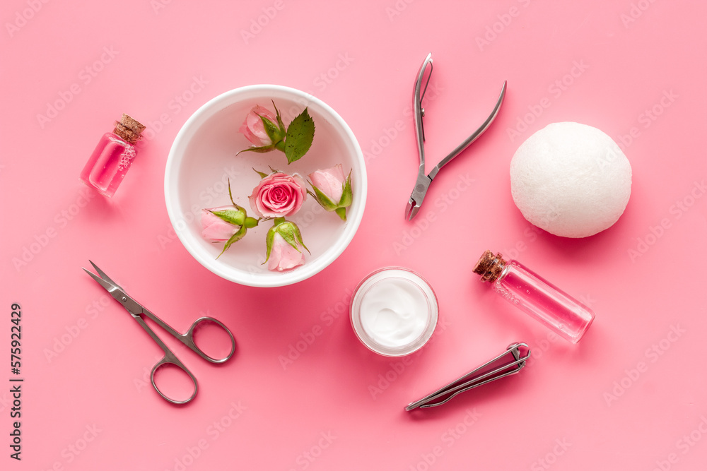 Manicure scissor and hands care cosmetics set with flowers. Manicure scissor and hands care cosmetics set with flowers.