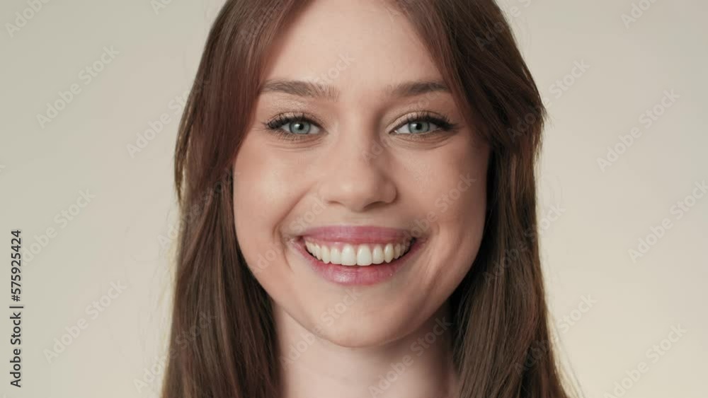 Portrait of cheerful caucasian woman in the studio. Shot with RED helium camera in 8K. Portrait of cheerful caucasian woman in the studio. Shot with RED helium camera in 8K.