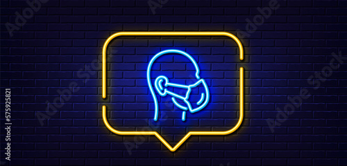 Neon light speech bubble. Medical mask line icon. Safety breathing respiratory mask sign. Coronavirus face protection symbol. Neon light background. Medical mask glow line. Brick wall banner. Vector