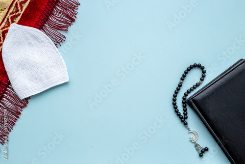 Islamic prayer rug with Muslim rosary with silver crescent moon. Islamic bsckground photo