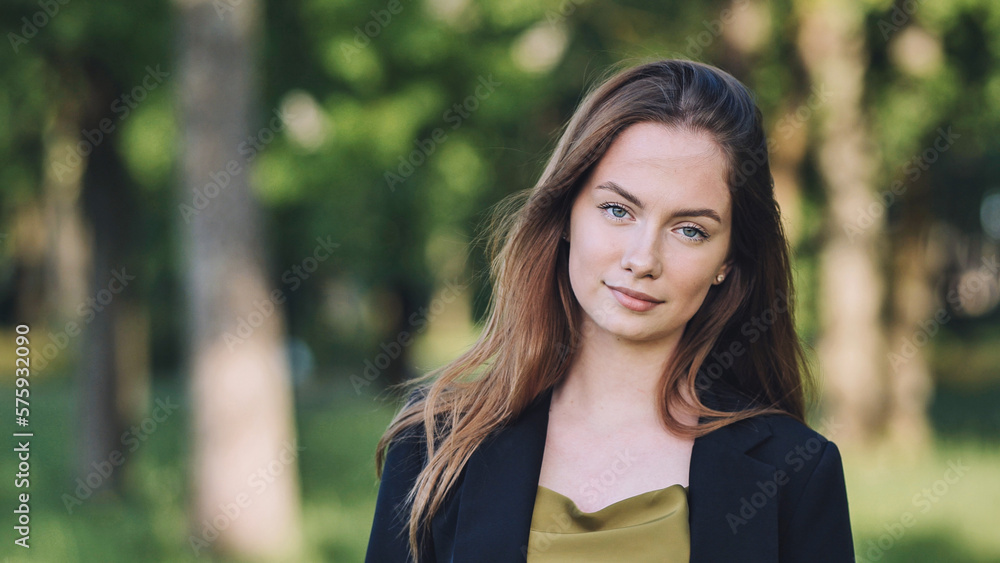 Portrait of a young student in a city park. Portrait of a young student in a city park.