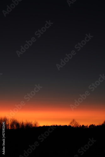 Real amazing panoramic sunrise or sunset sky with colorful clouds. Gradient color. Sky texture, abstract nature background