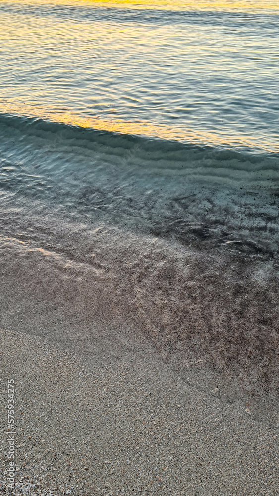 Beautiful beach at Alcudia Bay at sunrise. Ocean waves at sunrise. Ocean waves. Beautiful beach at Alcudia Bay at sunrise. Ocean waves at sunrise. Ocean waves.