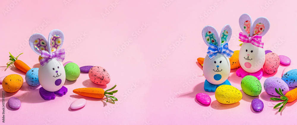 Festive Easter composition. Traditional symbols and decor - rabbits, eggs, carrots. Pastel design