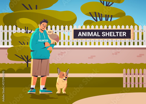 young man volunteer walking with dog and owl having fun generation Z lifestyle animal shelter concept