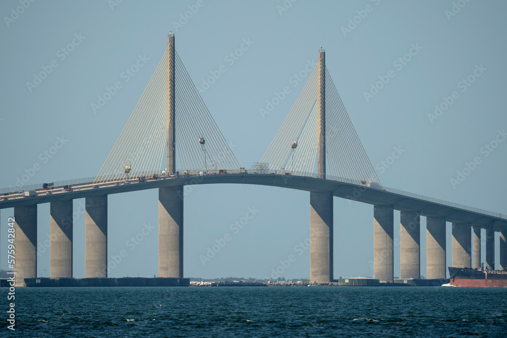 Sunshine Skyway Bridge over Tampa Bay in Florida with moving traffic. Concept of transportation infrastructure Sunshine Skyway Bridge over Tampa Bay in Florida with moving traffic. Concept of transportation infrastructure