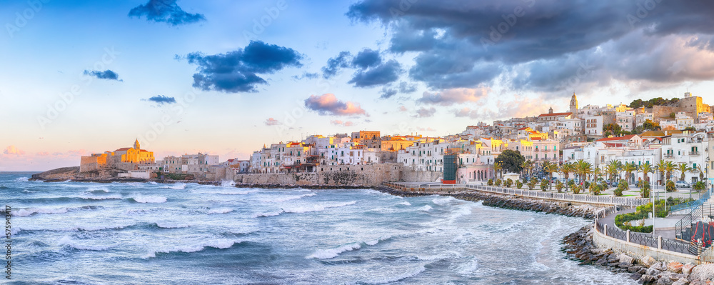 Marvelous  view of historic center and promenade of the city of Vieste at sunset