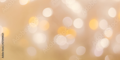 Abstract bokeh background beige colored, natural flare from lights, beige monochromatic photo with optical effect, blurred round bokeh texture as holiday banner, celebration wallpaper