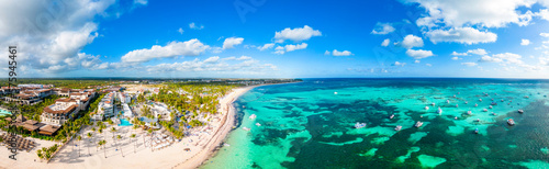 Aerial panorama of the large tropical beach with white sand and turquoise water of the Caribbean Sea. Best All Inclusive Hotels in Punta Cana © Bankerok