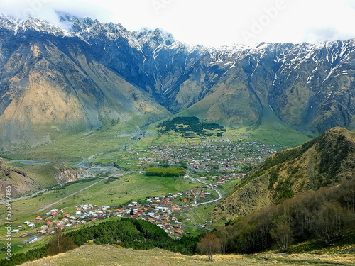 View of a village in a mountain valley. Georgia, Stepantsminda. High quality photo