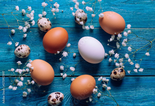 Photography Simple easter eggs, quial eggs on wooden background