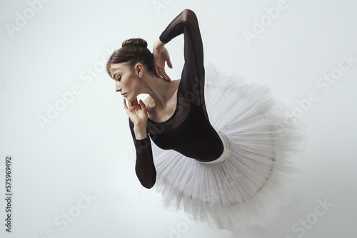 Fototapete angle from above on a ballerina up to the waist with her hands showing a dance