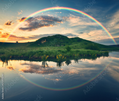 Landscape with a Rainbow on the River in Spring. colorful morning. nature of Ukraine