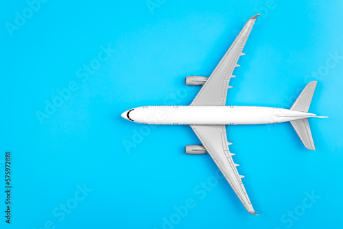 Wallpaper Mural White plane, airplane on a blue background, flat lay, copy space. Torontodigital.ca