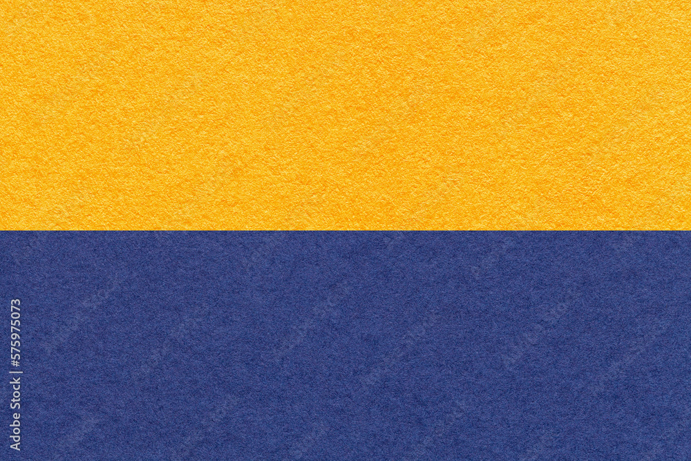 Texture of craft yellow and navy blue paper background, macro. Vintage golden and denim cardboard. Texture of craft yellow and navy blue paper background, macro. Vintage golden and denim cardboard.