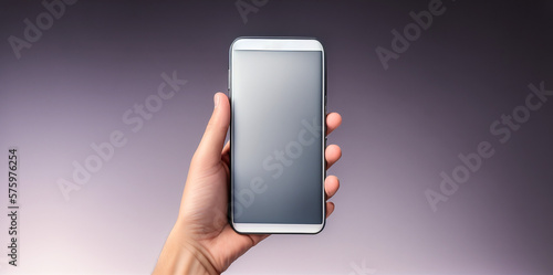One hand holding a smartphone / Mobile phone with blank display / Purple + Silver / Ideal for a presentation + decoration / Neutral background / Space for text / Blank text / Copy space
 photo