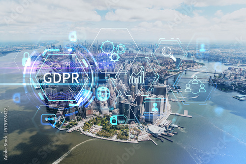 Aerial panoramic helicopter city view on Lower Manhattan district and financial Downtown, New York, USA. GDPR hologram, concept of data protection regulation and privacy for all individuals