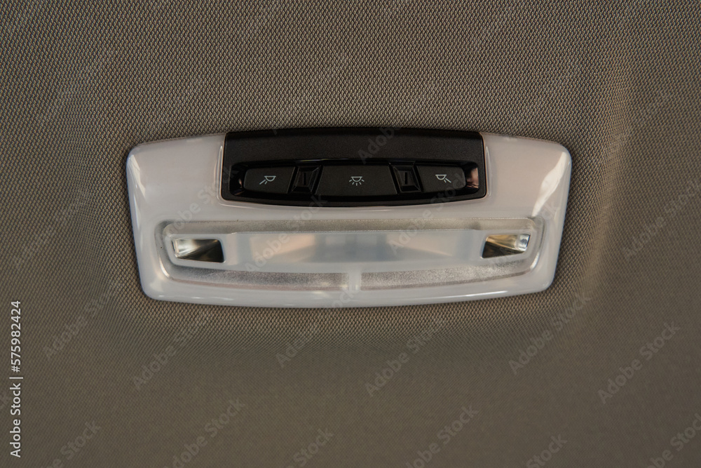 dome light for the rear row of seats with buttons to turn on and off the light on the gray ceiling dome light for the rear row of seats with buttons to turn on and off the light on the gray ceiling