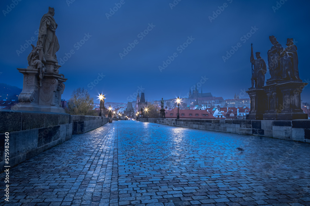 Charles Bridge, Prague at dramatic evening, Czech Republic, with night lighting