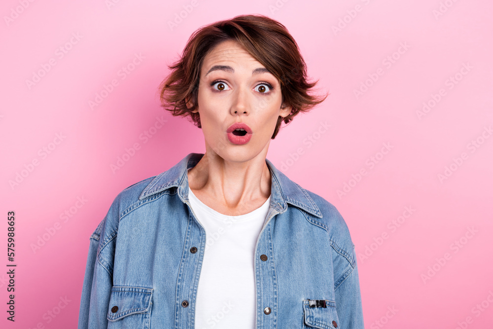 Photo portrait of surprised open mouth speechless unexpected reaction shocked girl wear stylish denim blazer isolated on pink color background Photo portrait of surprised open mouth speechless unexpected reaction shocked girl wear stylish denim blazer isolated on pink color background