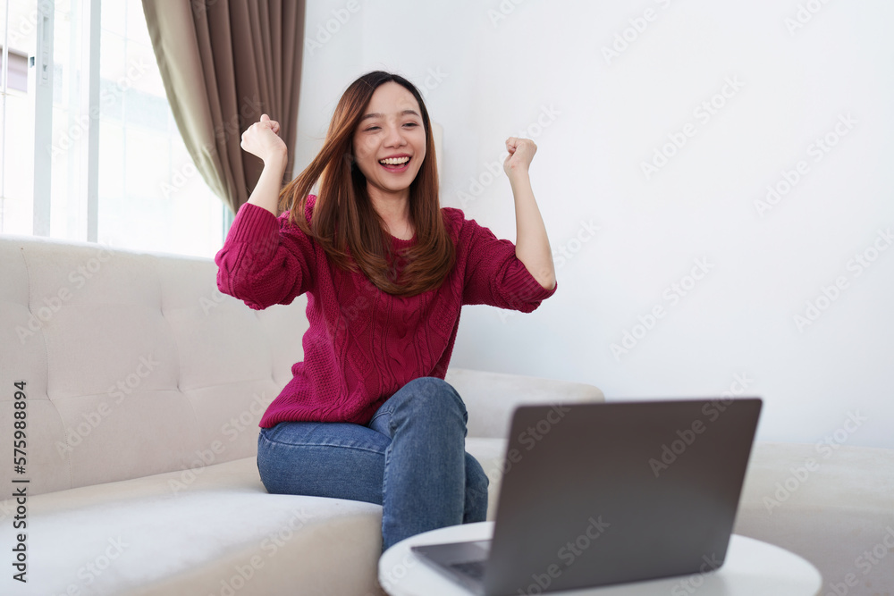 Asian business people happy to be successful partnership teamwork celebrating achievement and success concept. Beautiful business woman celebrate with laptop Asian business people happy to be successful partnership teamwork celebrating achievement and success concept. Beautiful business woman celebrate with laptop