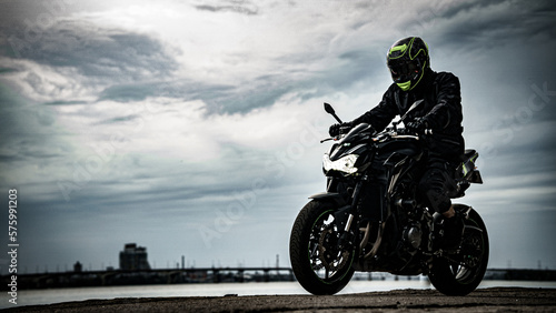 Black rider on the black motorbike photo