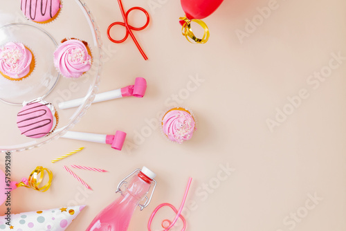 Preparing for birthday party. Attributes of holiday on pink background. Top view. Copy space