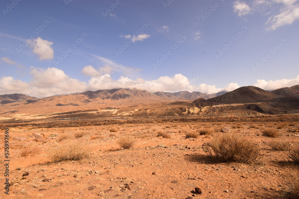 Mountain landscape with a sandy strip on a sunny day Mountain landscape with a sandy strip on a sunny day