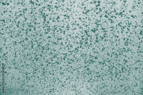 Bubble turquoise texture background little shampoo bubbles. © vittaliya