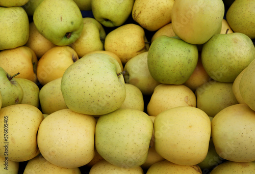 organic and fresh yellow apples at the market