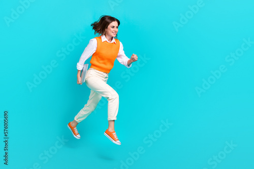 Full body length photo cadre of young real estate agent lady wear shirt vest hold laptop running hold laptop advert isolated on cyan color background