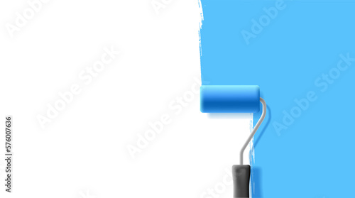 Paint roller with streaks of blue paint on the wall. Painting works, repairs, creative concepts. Top view. photo