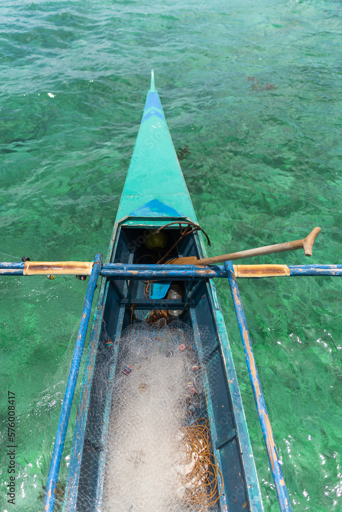 vertical photo of a typical Filipino traditional fishing boat