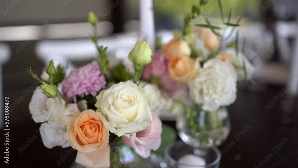 A very nicely decorated wedding table appointments with beautiful decor with plates and serviettes in spring garden. Beautiful flowers on table in wedding day. The elegant dinner table. Wedding day A very nicely decorated wedding table appointments with beautiful decor with plates and serviettes in spring garden. Beautiful flowers on table in wedding day. The elegant dinner table. Wedding day