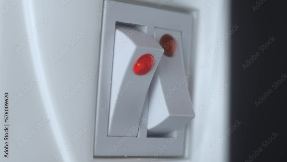 Man hand turn on button on thermostat of electrical heater radiator to control heat macro view. Rising costs in private households for gas bill due to inflation and war, Energy crisis in Europe Man hand turn on button on thermostat of electrical heater radiator to control heat macro view. Rising costs in private households for gas bill due to inflation and war, Energy crisis in Europe