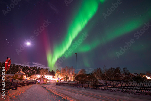 Northern lights over a small town. Nykarleby/Uusikaarlepyy, Finland
